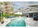 Enjoy swimming in the private screened-in pool and spa with access to the backyard at 2318 Kenwick Dr, Valrico, FL 33596