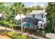 The backyard features a screened pool, rv parking, and lush landscaping at 2318 Kenwick Dr, Valrico, FL 33596