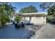 Cozy backyard deck area with seating, perfect for relaxing and entertaining outdoors at 284 North St, Palm Harbor, FL 34683