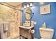 This bathroom features a walk-in shower and a vanity at 284 North St, Palm Harbor, FL 34683