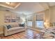 Bedroom with terra cotta tile floor, sofa, and comfortable furnishings at 284 North St, Palm Harbor, FL 34683