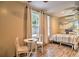 Cozy bedroom with light wood floors, comfortable bed and modern mini-split AC unit at 284 North St, Palm Harbor, FL 34683