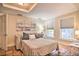 Bedroom with terra cotta tile floor, sofa, and comfortable furnishings at 284 North St, Palm Harbor, FL 34683