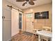 This space features a ceiling fan and a flat screen TV mounted on the wall at 284 North St, Palm Harbor, FL 34683
