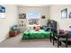 Bright bedroom featuring neutral walls, carpeted floors, and a sunny window view at 2925 Evergreen Elm Pass, Wesley Chapel, FL 33543