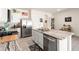 Bright kitchen featuring stainless appliances, a center island with a sink, and ample counter space at 2925 Evergreen Elm Pass, Wesley Chapel, FL 33543