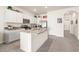 Modern kitchen with stainless steel appliances, granite countertops, and white cabinetry at 2925 Evergreen Elm Pass, Wesley Chapel, FL 33543