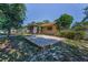 Backyard view of the home, landscaping, and potential sandbox area at 3041 Oak View Dr, Palm Harbor, FL 34684
