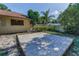 Backyard view of the home, landscaping, and potential sandbox area at 3041 Oak View Dr, Palm Harbor, FL 34684