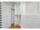 Organized walk-in closet with built-in shelving and drawer units at 3041 Oak View Dr, Palm Harbor, FL 34684