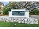 Entrance sign for the deed-restricted community of Rustic Oaks at 3041 Oak View Dr, Palm Harbor, FL 34684