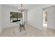 Dining area with glass table and a view of the neighborhood at 3041 Oak View Dr, Palm Harbor, FL 34684