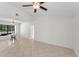 Open dining area features neutral walls, tile flooring, and a large window at 3041 Oak View Dr, Palm Harbor, FL 34684
