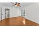 Spacious living room with ceiling fan and french doors leading outside at 3041 Oak View Dr, Palm Harbor, FL 34684
