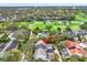 An aerial view of the home showcasing its location near a golf course and lush greenery at 3105 W San Isidro St, Tampa, FL 33629