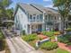 Home exterior featuring balconies, lush landscaping, and inviting entrance, blending charm with modern living at 3105 W San Isidro St, Tampa, FL 33629
