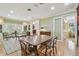 Inviting living room with hardwood floors, a large table, and views of the entryway at 3105 W San Isidro St, Tampa, FL 33629