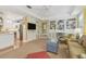 Open-concept living room with a fireplace, built-ins, and seamless access to the kitchen at 3105 W San Isidro St, Tampa, FL 33629