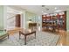 Spacious living room with built-in bookshelves, hardwood floors, and views to the staircase at 3105 W San Isidro St, Tampa, FL 33629