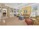 Cozy Gathering room featuring a built-in bookcase and comfortable seating near sunlit windows at 3105 W San Isidro St, Tampa, FL 33629