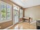 Bright office with a large window, a glass paned door, and hardwood floors at 3105 W San Isidro St, Tampa, FL 33629