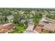 Expansive aerial view of home showcasing a large, beautifully landscaped yard and neighborhood at 3207 Hilltop Ln, Largo, FL 33770