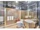 Mirrored bathroom with a glass enclosed shower and modern fixtures at 3207 Hilltop Ln, Largo, FL 33770