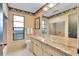 Classic bathroom with granite countertop, shower stall, and patterned wallpaper at 3207 Hilltop Ln, Largo, FL 33770