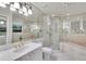 Bright bathroom with corner shower and gold-colored faucets and bath fixtures at 3207 Hilltop Ln, Largo, FL 33770