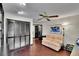 The cozy bonus room is completed by hardwood floors and a comfortable sofa at 3207 Hilltop Ln, Largo, FL 33770