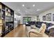Cozy living room featuring hardwood floors and ample seating with natural lighting at 3207 Hilltop Ln, Largo, FL 33770