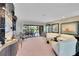 Spacious living room boasts large windows, access to a patio, and refined furnishings for comfortable living at 3207 Hilltop Ln, Largo, FL 33770
