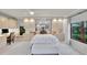 Bright main bedroom with carpet and built in cabinets over bed and desk nook at 3207 Hilltop Ln, Largo, FL 33770