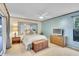 Airy main bedroom with a window and a TV, with sliding glass door on adjacent wall at 3207 Hilltop Ln, Largo, FL 33770