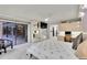 Bright main bedroom boasts sliding glass doors to a patio and a view of the backyard at 3207 Hilltop Ln, Largo, FL 33770