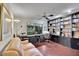 Office boasts hardwood floors, built-in shelving, and a comfortable sitting area at 3207 Hilltop Ln, Largo, FL 33770