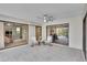 Covered outdoor patio with seating area and sliding glass doors to various rooms of the house at 3207 Hilltop Ln, Largo, FL 33770
