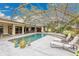 View of the screened-in pool highlighting the tile deck and lounge chairs at 3207 Hilltop Ln, Largo, FL 33770