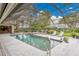 Gorgeous screened-in pool with ample patio space for entertaining and relaxing at 3207 Hilltop Ln, Largo, FL 33770