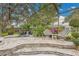 A delightful rock waterfall cascades into the screened-in pool area at 3207 Hilltop Ln, Largo, FL 33770