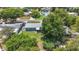 Aerial view of a property featuring a well-maintained backyard, mature trees, and a screened-in porch at 3271 36Th N St, St Petersburg, FL 33713