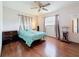 Cozy bedroom with hardwood floors, natural light, and simple furnishings at 3271 36Th N St, St Petersburg, FL 33713