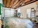 Spacious garage featuring an automatic door, workbench, and ample storage space for tools and equipment at 3271 36Th N St, St Petersburg, FL 33713