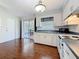 Well-lit kitchen features a sink beneath a window with direct access to the porch at 3271 36Th N St, St Petersburg, FL 33713