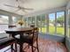 Sunroom with table and chairs, surrounded by windows offering views of the outdoor area at 3271 36Th N St, St Petersburg, FL 33713