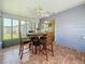 Sunroom with a table, chairs, and terra cotta floors for indoor / outdoor living at 3271 36Th N St, St Petersburg, FL 33713