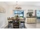 Cozy dining area with a wooden table, stylish chairs, and plenty of natural light at 36312 Garden Wall Way, Zephyrhills, FL 33541