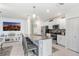 Well-equipped kitchen featuring stainless steel appliances, a granite island, and ample cabinet space at 36312 Garden Wall Way, Zephyrhills, FL 33541