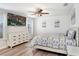 Bright main bedroom with wood floors, neutral tones, and ceiling fan at 36312 Garden Wall Way, Zephyrhills, FL 33541