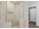 Modern bathroom features a glass-enclosed shower and stylish tile work at 4807 W Longfellow Ave, Tampa, FL 33629